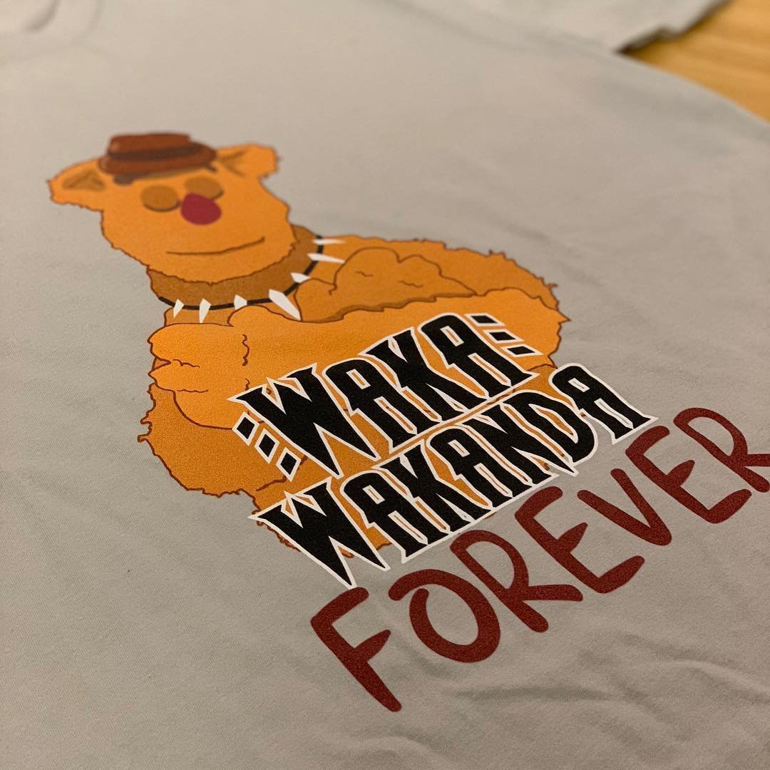 Waka Wakanda Forever T-shirt — a fuzzy bear comedian in a clawed necklace